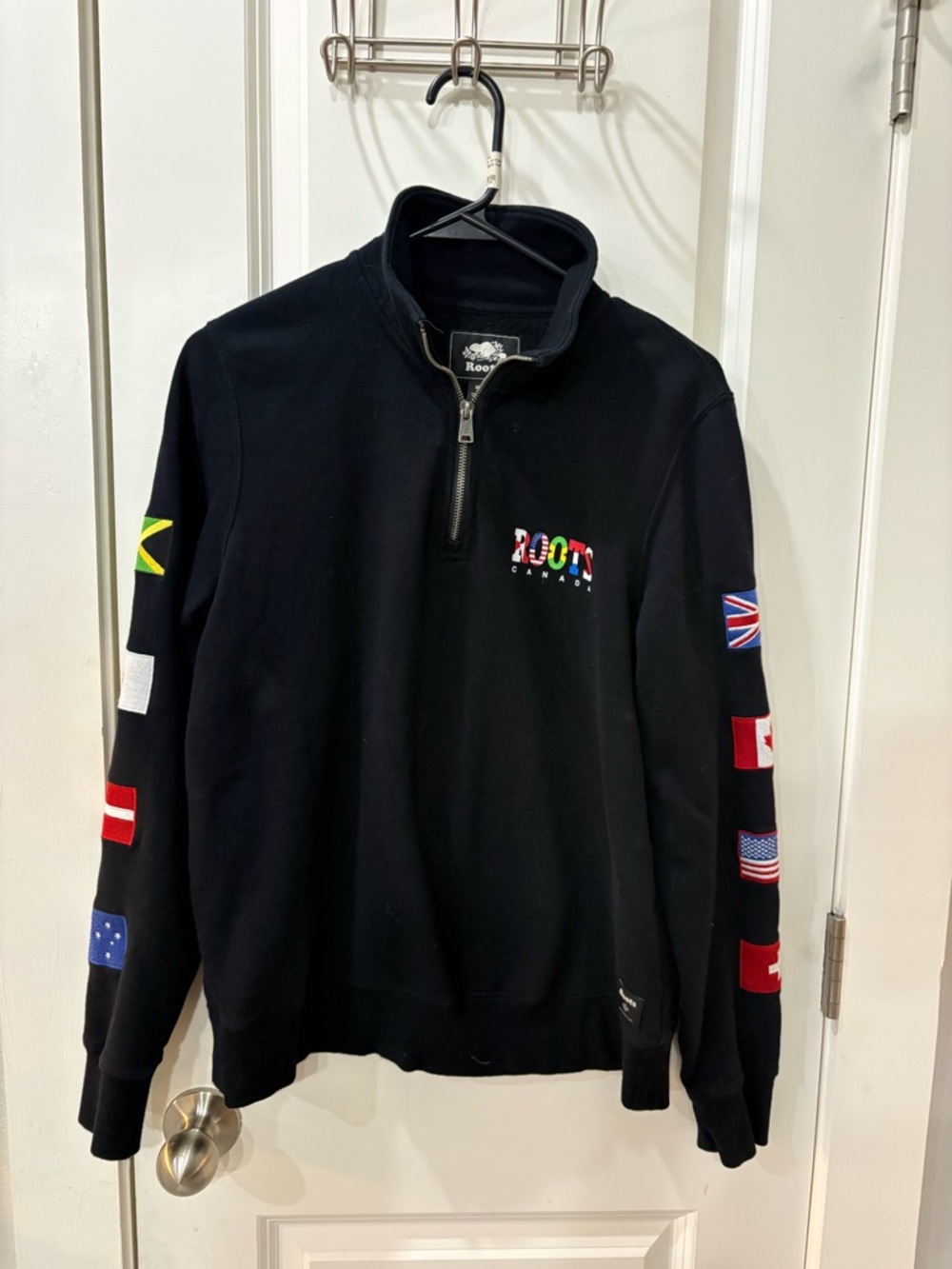 Roots Black Quarter-Zip Sweater with Multicolor Flag Embroidery